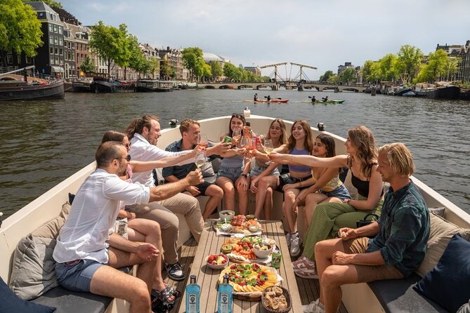 Amsterdam: Evening Candle Light Cruise With Wine & Cheese - Route highlights: Red Light District, NEMO area, and the classic bridge run