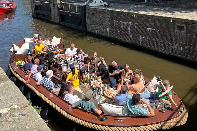 Amsterdam Luxury Boutique Boat tour with Unlimited Beer and Wine - Magere Brug (Skinny Bridge): your photo moment, guided by the captain