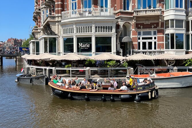 Amsterdam Luxury Boutique Boat tour with Unlimited Beer and Wine - Guide style: Justin, Butter, Ben, Josua—and why structure matters