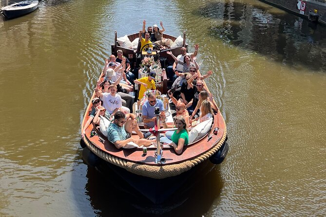 Amsterdam Luxury Boutique Boat tour with Unlimited Beer and Wine - Boat type and comfort: open boat expectations vs covered reality