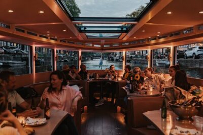 Amsterdam Small-Group Evening Canal Cruise Including Wine, Craft Beer, Cheese - Getting on board: small-boat comfort without the big-tour vibe