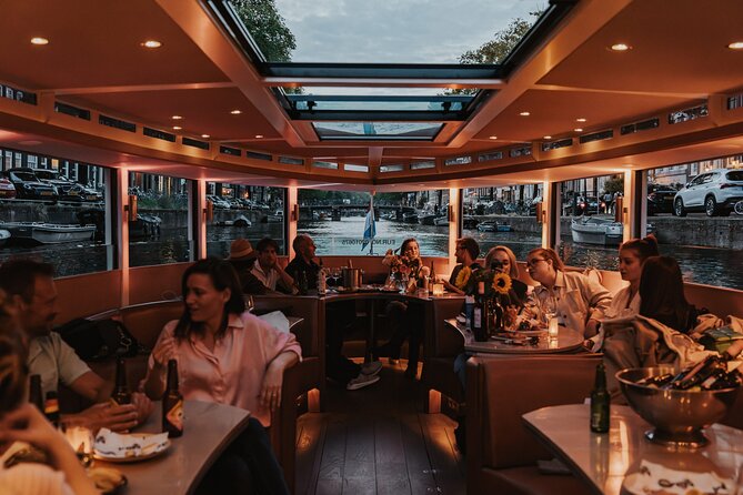 Amsterdam Small-Group Evening Canal Cruise Including Wine, Craft Beer, Cheese - Getting on board: small-boat comfort without the big-tour vibe