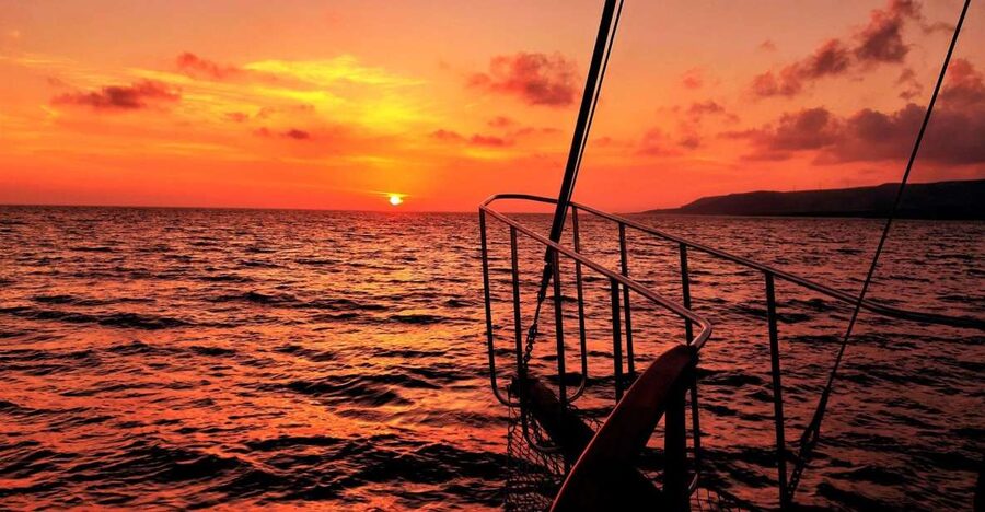 Argostoli: Sunset Cruise with Swim Stops, Dinner, and Wine - Homemade dinner on deck: moussaka, salad, and wine that keeps coming