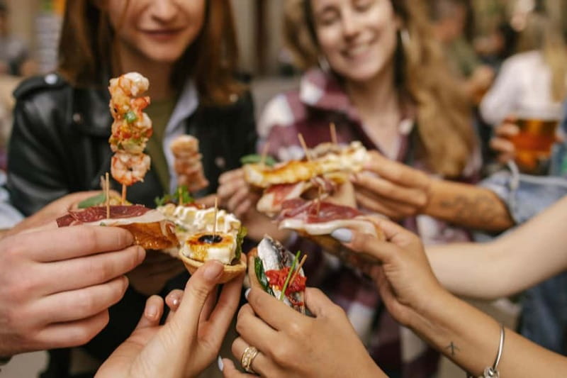 Barcelona: Food Walking Tour with Tapas and Wine - What the Guide Adds: Stories, Architecture, and Catalan Culture