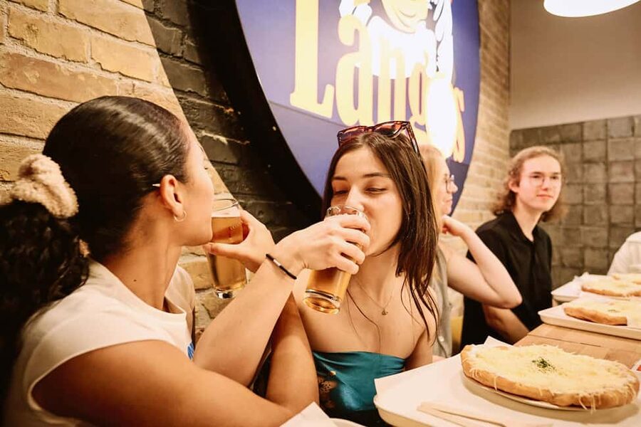 Budapest: Guided Street Food Tour with Sweet Wine - Street food hour: Lángos, soup, and eating like you mean it