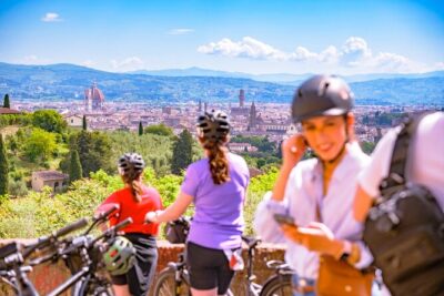 Chianti Hills E-Bike Tour with Tuscan Lunch & Two Wine Tastings - Riding out of town: what Impruneta and the first photo pauses feel like