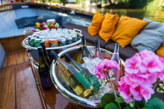 Classic Salonboat Tour in Amsterdam Including Cheese and Wine - Churches, silence spots, and quirky extras along the route