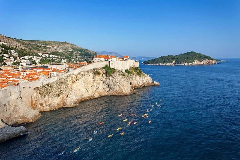 Dubrovnik: Guided Sunset Sea Kayaking Tour with Wine - Meeting at Pile Square: finding the kayaks before the tide turns