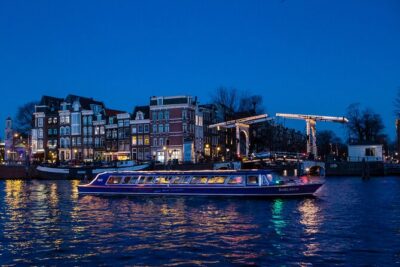 Evening Canal Cruise in Amsterdam with Wine & Cheese Option - Where the experience lands: recorded audio, not a lecture hall