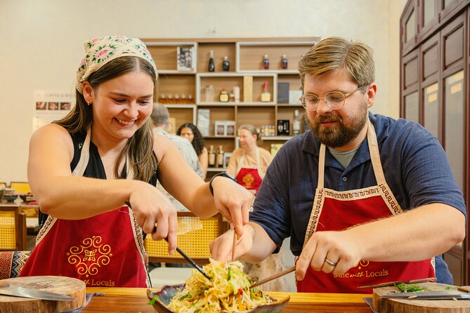Experience Hanoi Cooking Class with Free Wine Tasting - Four Iconic Dishes: Hands-On Meal Building