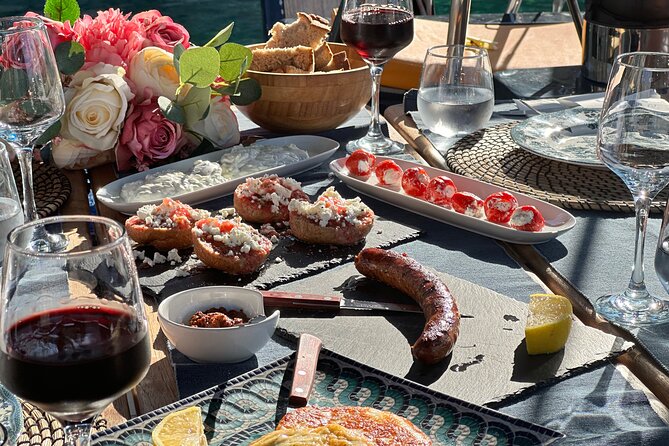 Greek Gastronomy & Wine Pairing Cruise with a Sommelier in Athens - Leaving Athens Behind: Sailing Toward Ydrousa