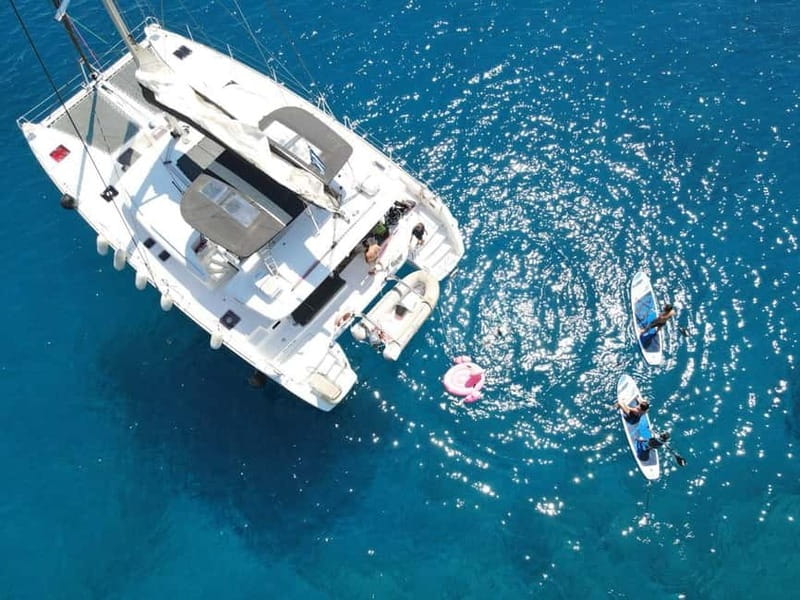 Heraklion: Dia Island Catamaran Cruise with Dinner and Wine - Dia Island Bay Time: Snorkeling, SUP, Fishing, and Inflatable Toys
