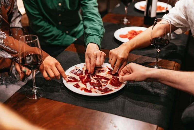 Madrid: Guided Tapas and Wine Tour with Rooftop Views - Plaza Mayor and Barrio de las Letras: history you can actually walk through