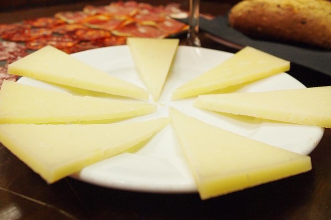Madrid Local's Wine and Tapas Lunch Tour with a side of History - Two tavern stops and the wine lineup you can compare
