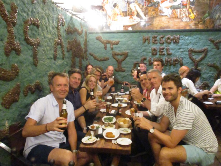 Madrid: Old Madrid Walking Food and Wine Tour - Inside the Bars: The Dishes That Define Madrid Tapas