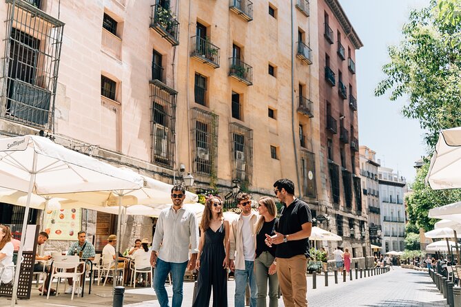 Madrid Tapas & Wine Tour with Rooftop Views and Local Guide - Calle de las Huertas: Carrilleras, Smashed Potatoes, and Red Wine