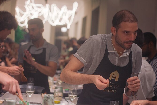 Paella Cooking Class in Madrid with Bottomless Wine Pairing - The Cooking Clubhouse setup: stations, pacing, and pair cooking