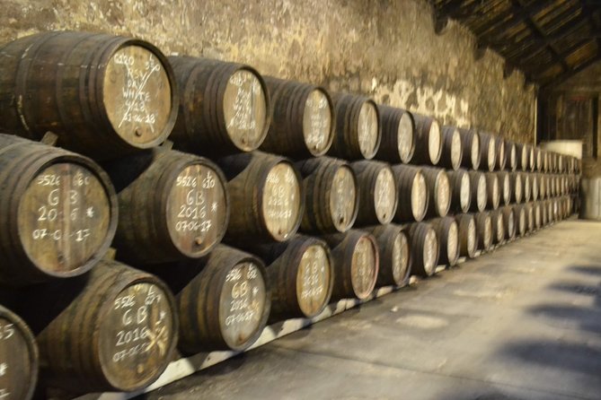 Porto: Port and Douro Wine Walking Tour With 9 Wine Tastings - Stop 3: Fonseca Porto and the big-house cellar experience