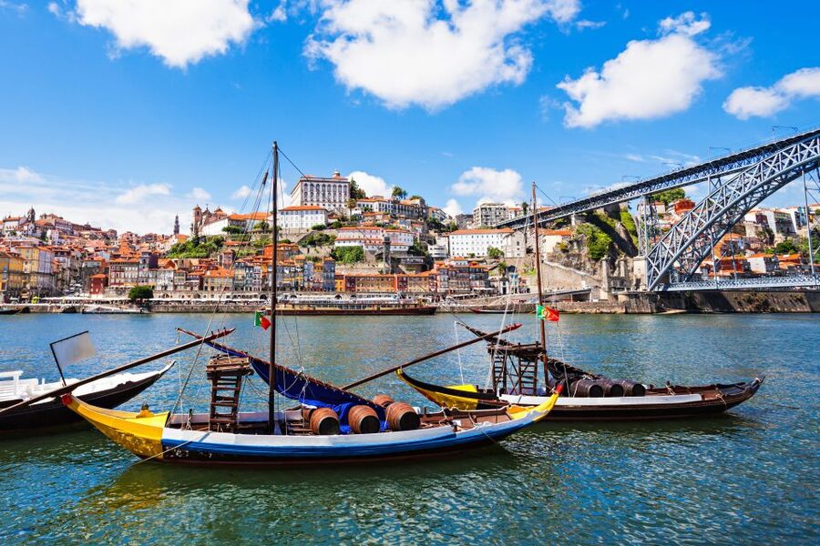Porto: Tuk-Tuk Tour, Douro River Cruise, and Wine Tasting - The Douro River on a rabelo: six bridges, wine cellars, and an easy schedule