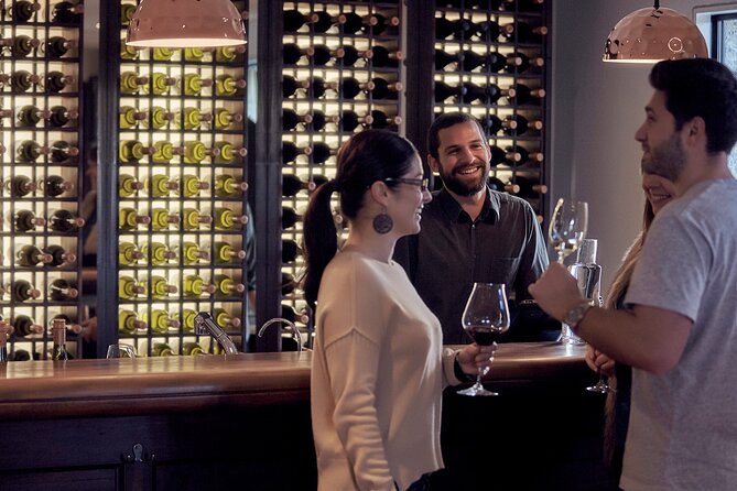 Queenstown Afternoon Wine Tour - Peregrine | Kinross | Amisfield - Amisfield Cellar Door: stone building, views, and the final pours