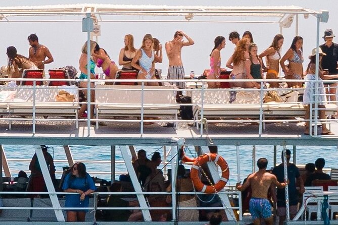 Rhodes Bay to Bay Swim Cruise-Greek Buffet w/wine included - Ladiko Bay passed by: caves, oil trade stories, and a slower pace