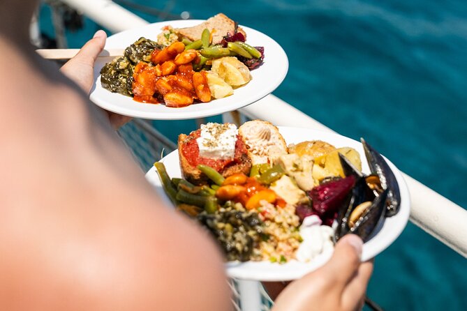 Rhodes Bay to Bay Swim Cruise-Greek Buffet w/wine included - Afandou Beach and caves: pebbles, pirate raids, and the meaning of invisible