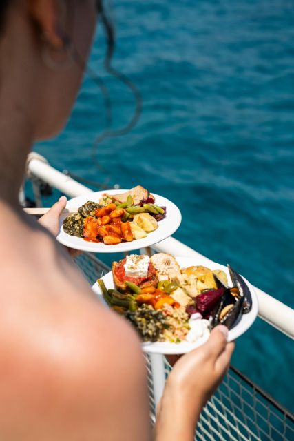 Rhodes: Bay to Bay Swim Cruise with Greek Buffet and Wine - Kalithea Springs: the first swim stop with a famous seaside setting