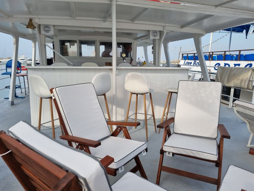 Rhodes: Bay to Bay Swim Cruise with Greek Buffet and Wine - Deck comfort and the “party without trying” vibe