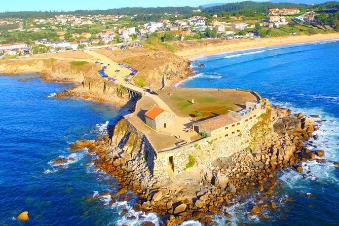 Rias Baixas Tour with Winery and Boat (optional) - Praia da Lanzada: bay views, stones, and sea legend mood