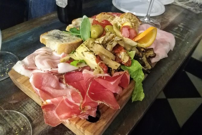 Rome: Trastevere Food Tour Wine Tasting and Local Expert Guide - Stop 2: Tiber Island and the sites around the waterline