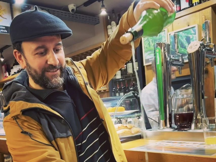 San Sebastian: Market, Pintxos and Wine Tasting Tour - Market First: ham, olives, and the makers behind your bites