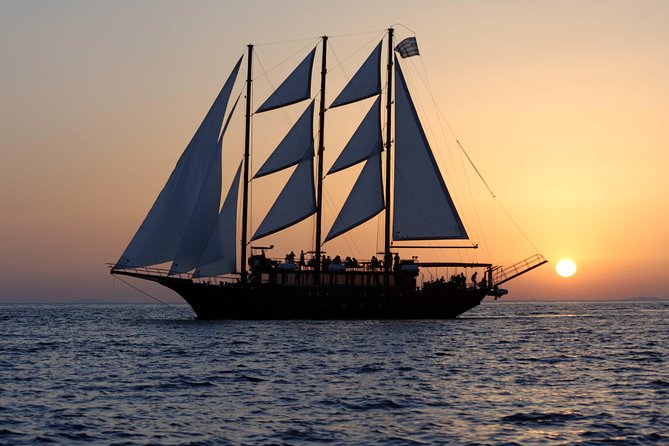 Santorini Caldera Sunset Sailing Cruise with Dinner and Wine - Stop 1: Santorini Volcano hiking, summit views, and the €5 entrance fee