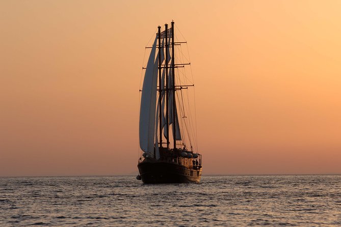Santorini Caldera Sunset Sailing Cruise with Dinner and Wine - Stop 3: Thirassia Bay dinner time with Greek buffet and free wine