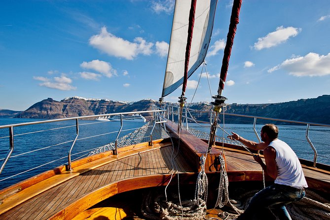Santorini Caldera Sunset Sailing Cruise with Dinner and Wine - Stop 4: Watching sunset near Oia from the water