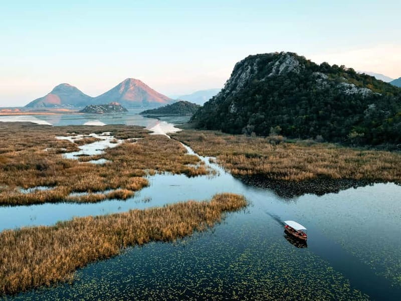 Skadar Lake: Guided Sunset Boat Tour with Wooden Boat & Wine - Wine on Board, Welcome Refreshments, and the Best Way to Sip