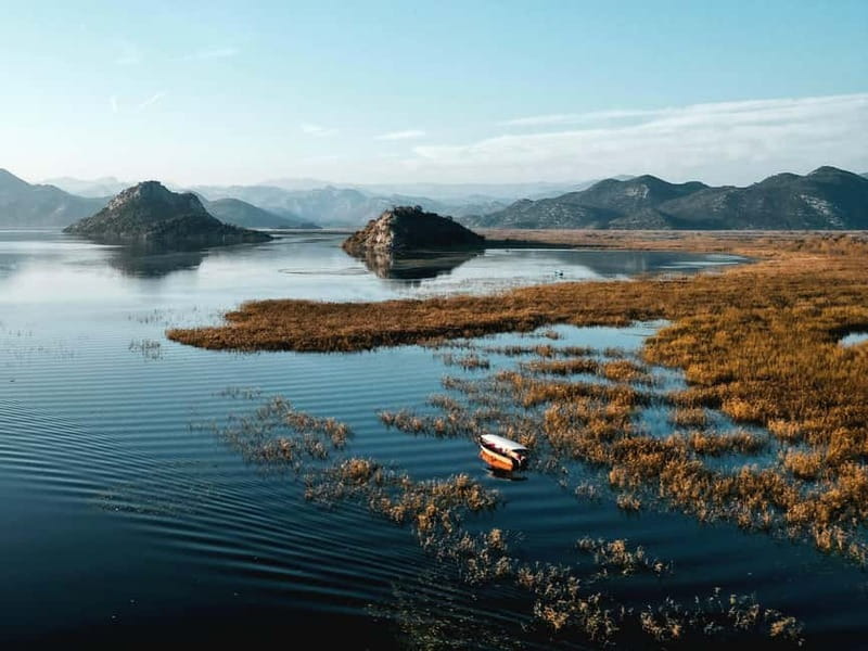 Skadar Lake: Guided Sunset Boat Tour with Wooden Boat & Wine - Swimming in Fresh Water and Simple Lake Etiquette