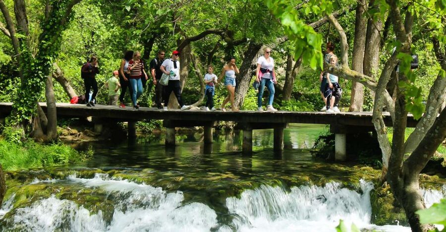 Split: Krka Waterfalls With Boat Cruise, Wine and Olive Oil - Skradinski buk waterfalls: travertine cascades you can walk beside