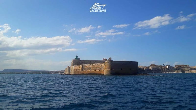 Syracuse: Boat Trip with Lunch, Wine, and Swimming Stops - Food and wine on board: typical starter, seasonal fruit, and a hot meal at sea