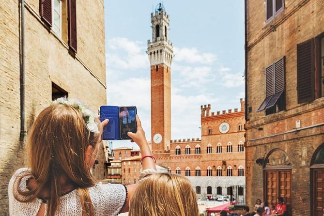 Tuscany Day Trip: Chianti & Cooking Class Small Group - San Gimignano at tour-time: towers, shops, and sunset energy