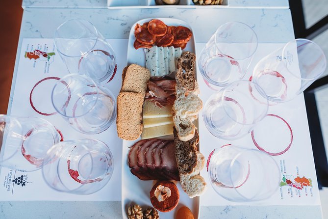 Wine and Cheese Tasting Lunch in Portuguese Wine Bar - What the guides bring: from humor to real technique